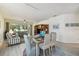 Open-concept living and dining area offering a view to a screened-in patio at 4500 Golf Club Ln, Spring Hill, FL 34609