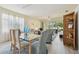 Open-concept living and dining area filled with natural light and comfortable seating at 4500 Golf Club Ln, Spring Hill, FL 34609