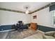 Spacious home office featuring hardwood floors and a neutral color palette at 4500 Golf Club Ln, Spring Hill, FL 34609