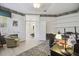 Home office showcasing hardwood floors with a view of the hallway and natural light at 4500 Golf Club Ln, Spring Hill, FL 34609