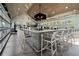 Community bar featuring a light-colored wood paneled ceiling, expansive island, and ample seating at 4910 Southern Valley Loop, Brooksville, FL 34601
