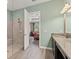 Elegant bathroom shows a glass-enclosed shower and a doorway leading to the bedroom at 4910 Southern Valley Loop, Brooksville, FL 34601