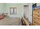 Bedroom featuring a mirror and view of a hallway leading to another room at 4910 Southern Valley Loop, Brooksville, FL 34601