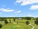 Scenic aerial view showcasing a meticulously manicured golf course with rolling greens at 4910 Southern Valley Loop, Brooksville, FL 34601