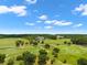 Expansive aerial view of a golf course with lush green fairways and beautiful landscaping at 4910 Southern Valley Loop, Brooksville, FL 34601