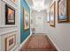 Entryway featuring elegant decor and a colorful runner leading to the main living spaces at 4910 Southern Valley Loop, Brooksville, FL 34601