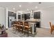 Gourmet kitchen boasts stainless steel appliances, dark cabinetry, and a center island with barstool seating at 4910 Southern Valley Loop, Brooksville, FL 34601