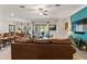 Cozy living area with hardwood floors leading to the kitchen and backyard views at 4910 Southern Valley Loop, Brooksville, FL 34601