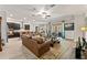 Bright living space open to the kitchen and dining area, featuring sliding glass doors and modern finishes at 4910 Southern Valley Loop, Brooksville, FL 34601