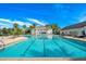 Large, inviting swimming pool with clear blue water and ample deck space for lounging at 4910 Southern Valley Loop, Brooksville, FL 34601