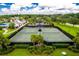 Overhead view of tennis and pickleball courts and manicured landscaping at 4910 Southern Valley Loop, Brooksville, FL 34601