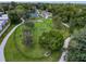 Spacious dog park featuring play structures and lush green space for pets to exercise and socialize at 5147 Larch Ln, New Port Richey, FL 34653