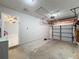 This garage features a garage door with a door leading to the rest of the house at 5147 Larch Ln, New Port Richey, FL 34653