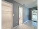 Hallway with tile floors and views into the closet, bathroom, and the outside at 5147 Larch Ln, New Port Richey, FL 34653