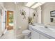 Well-lit bathroom with modern fixtures and convenient access to the outdoor pool area at 5164 Golf Club Ln, Spring Hill, FL 34609