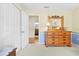 Bright bedroom with adjacent bathroom and view of hardwood floors at 5164 Golf Club Ln, Spring Hill, FL 34609