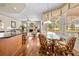 Cozy breakfast nook with a glass table and views of the pool and outdoor area at 5164 Golf Club Ln, Spring Hill, FL 34609