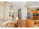 Bright dining nook with seating area, glass table, view of kitchen and natural light at 5164 Golf Club Ln, Spring Hill, FL 34609