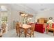 Bright dining area with views of the pool and easy access to the living room at 5164 Golf Club Ln, Spring Hill, FL 34609