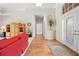 Grand foyer with wood floors, and decorative niche for displaying art at 5164 Golf Club Ln, Spring Hill, FL 34609