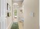 Bright hallway leading to the backyard pool area, adjacent to a well-appointed bathroom at 5164 Golf Club Ln, Spring Hill, FL 34609