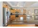 Well-equipped kitchen featuring an island, stainless steel appliances, and wooden cabinetry at 5164 Golf Club Ln, Spring Hill, FL 34609