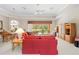 Open living space with plush sofas, built-in cabinets, and access to the lanai at 5164 Golf Club Ln, Spring Hill, FL 34609