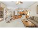 Open concept living area with kitchen island, dining nook, and comfortable seating at 5164 Golf Club Ln, Spring Hill, FL 34609