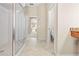 Bathroom featuring walk in shower and access to toilet and Primary bedroom at 5164 Golf Club Ln, Spring Hill, FL 34609