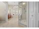 Luxurious bathroom with walk in shower, jacuzzi, and double vanity at 5164 Golf Club Ln, Spring Hill, FL 34609