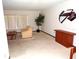 Neutral living room with tan carpet, white walls, and minimal decorations at 5248 Frost Rd, Spring Hill, FL 34606