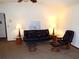 Cozy living room showcasing comfortable black leather seating and a serene ambiance at 5248 Frost Rd, Spring Hill, FL 34606