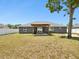 Expansive backyard boasting a charming pergola and a well-kept lawn at 5341 Birchwood Rd, Spring Hill, FL 34608