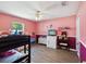 This bedroom is decorated with bunk beds, dresser, toys, and a window with natural light at 5341 Birchwood Rd, Spring Hill, FL 34608