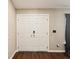 Close-up of the front door and entryway with hardwood floors at 5341 Birchwood Rd, Spring Hill, FL 34608