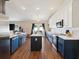 Bright kitchen with marble backsplash, stainless appliances, wood floors and plenty of storage at 5341 Birchwood Rd, Spring Hill, FL 34608