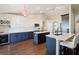 An open kitchen is shown with an island, stainless appliances, and lots of counter space at 5341 Birchwood Rd, Spring Hill, FL 34608