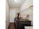 Laundry room with new front load washer and dryer, laminate flooring, and shelving at 5341 Birchwood Rd, Spring Hill, FL 34608