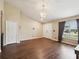 Bright living area featuring a chandelier and hardwood floors at 5341 Birchwood Rd, Spring Hill, FL 34608