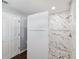 Beautifully tiled shower with mosaic flooring and brushed nickel fixtures at 5341 Birchwood Rd, Spring Hill, FL 34608