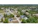 Aerial view of the property surrounded by lush greenery in a neighborhood at 5378 Mosquero Rd, Spring Hill, FL 34606