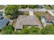 This is a house with a well-maintained roof and a long driveway surrounded by mature trees at 5378 Mosquero Rd, Spring Hill, FL 34606