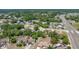 Aerial view of the property nestled among lush trees in a neighborhood at 5378 Mosquero Rd, Spring Hill, FL 34606
