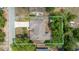 The property features a well-maintained roof, a long driveway, and mature trees, as well as plenty of green space at 5378 Mosquero Rd, Spring Hill, FL 34606