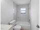 Bathroom featuring shower, tile and toilet at 5378 Mosquero Rd, Spring Hill, FL 34606