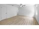 Bright bedroom featuring wood-look floors and a ceiling fan at 5378 Mosquero Rd, Spring Hill, FL 34606