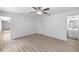 Bedroom with wood-look floors and ensuite bathroom at 5378 Mosquero Rd, Spring Hill, FL 34606