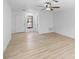 Neutral living area with wood floors and lots of natural light at 5378 Mosquero Rd, Spring Hill, FL 34606