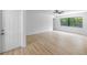 Spacious living area with wood flooring and a large window at 5378 Mosquero Rd, Spring Hill, FL 34606