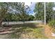 Expansive backyard featuring a well-maintained lawn and a classic white picket fence at 5638 Hereford Dr, New Port Richey, FL 34655
